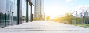 Exterior or modern office building, property transactions slow, but warehouse demand rises