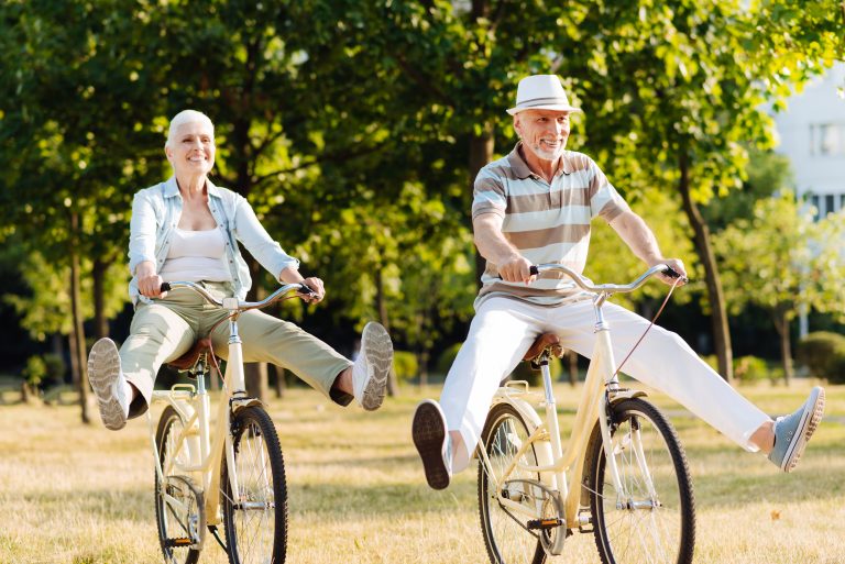 Retirement couple on their bikes having a day out In the countryside