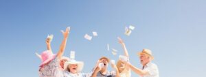 Group of senior citizens throwing money in air, sudden wealth