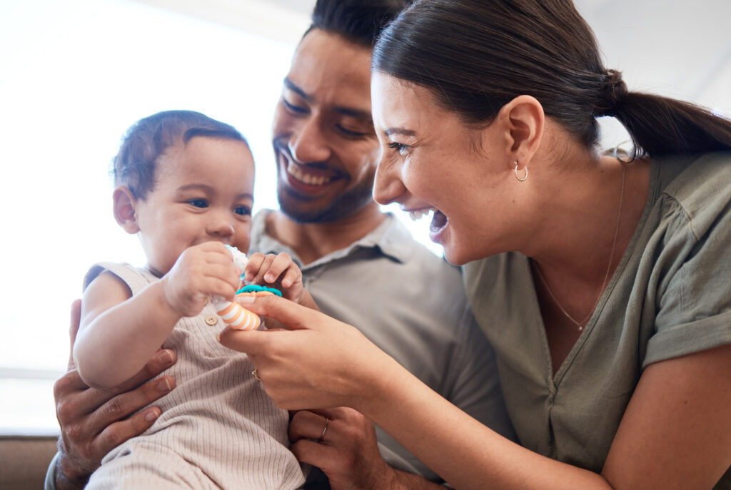 Mum and Dad with their baby, cost of raising children soars