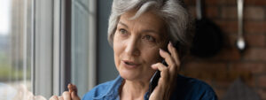 Woman on the phone to home insurance company