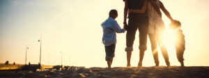 Family walking at sunset