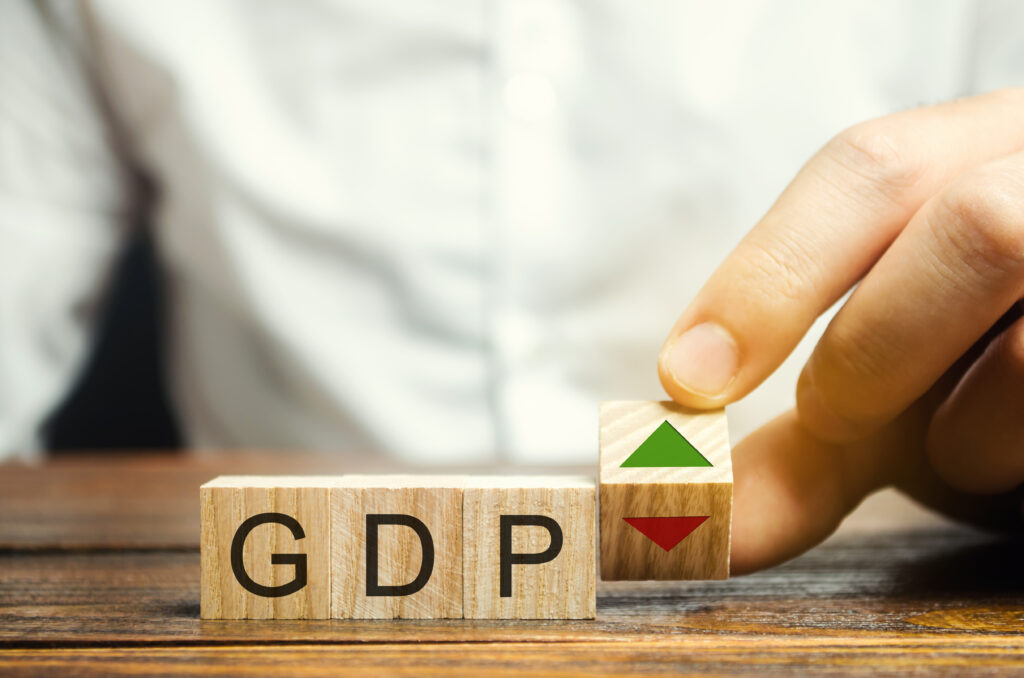 Wooden blocks with the word GDP and up and down arrows
