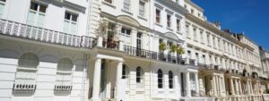 White luxury houses facades in London, Notting hill, street view and blue, prime property
