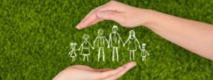 Two Woman’s open hands making a protection gesture isolated on green background. Family life insurance, protecting life.