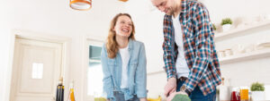 Couple enjoying making dinner in the kitchen