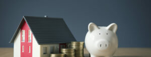 House model, coind and piggy bank concept, equity release on the rebound.